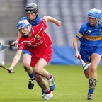 Rena Buckley displays great skill with hurley and ball as she leaves two Tipperary forwards trailing in the 2005 All-Ireland camogie final at Croke Park.jpg