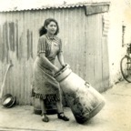 Madge Ahern (nee Coleman) from Dromin washing a churn after the delivery of milk to the creamery in the 1950s. Nowadays, milk is collected from dairy farms.jpg