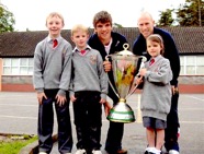 Rugby stars Donncha O’Callaghan and Peter Stringer brought the Heineken Cup to Cloghroe School in April 2006.jpg